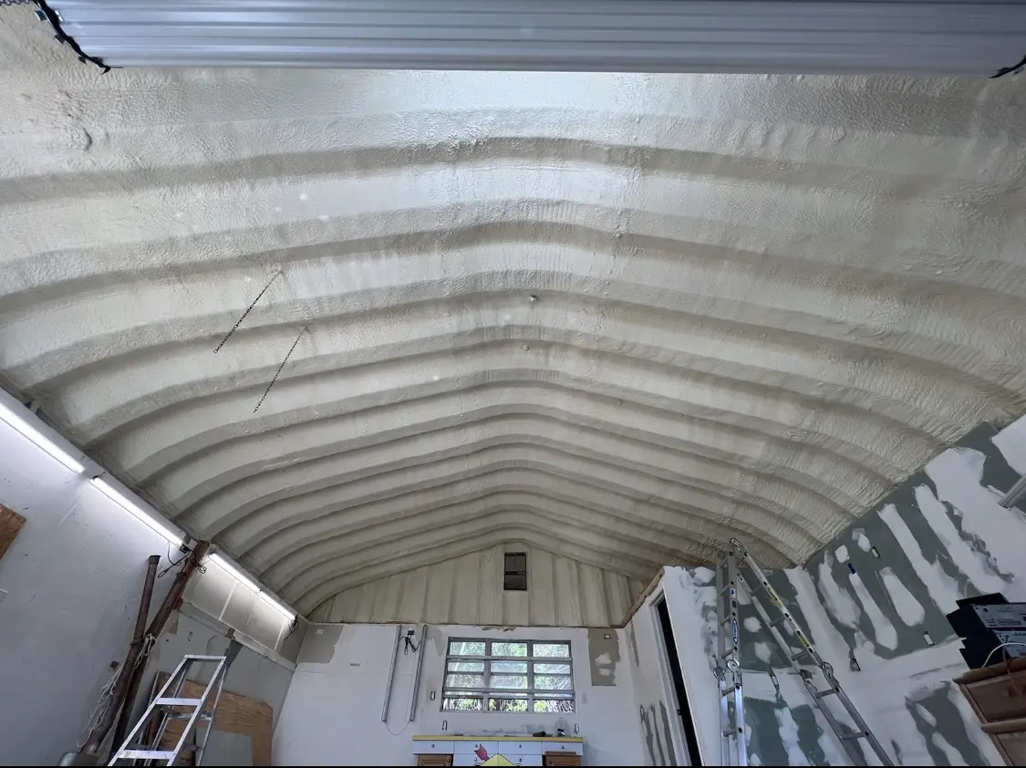 Spray polyurethane foam applied to the underside of a metal roof deck in Waseca